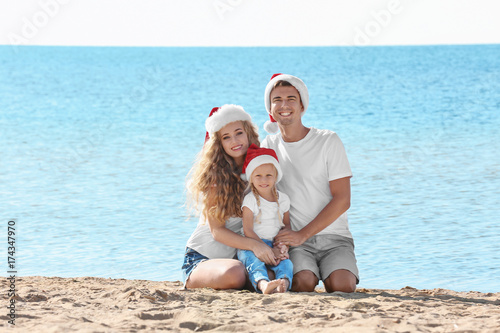 Young couple with girl on b...