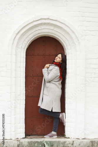 Brunette woman in a gray woolen coat © Andrey_Arkusha
