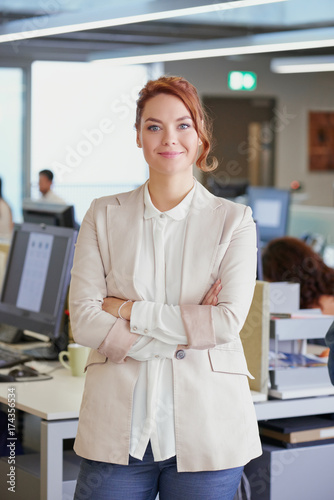 Portrait of attractive business woman team leader entrepenuer in trendy office photo