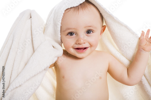 baby under a towel. isolated on a white background