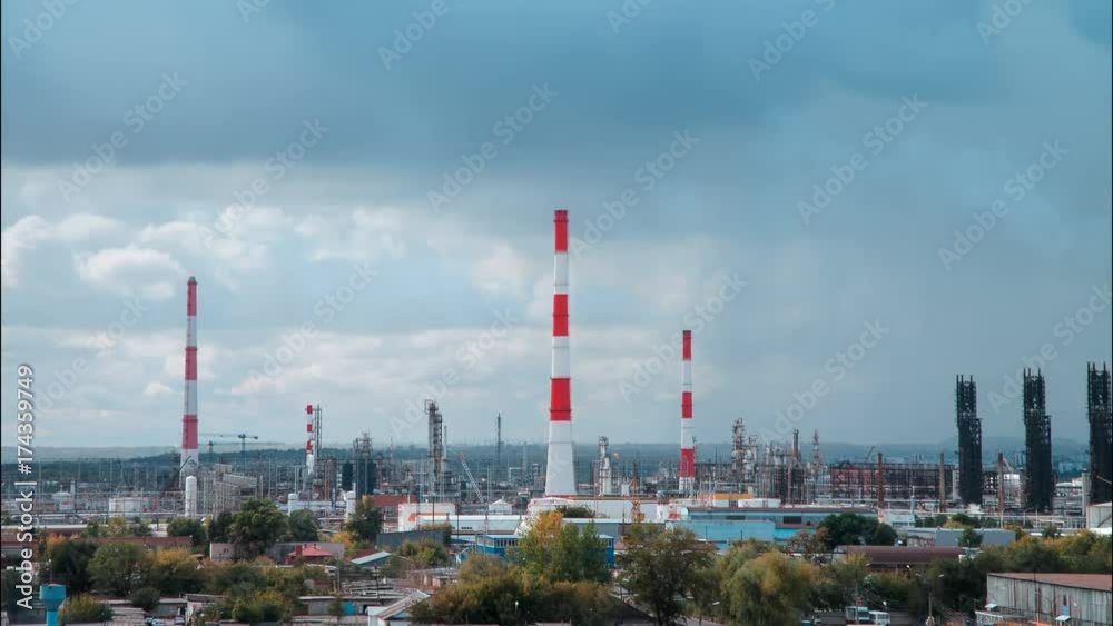 Oil refinery timelapse in sunny weather with clouds in background. Gas industry background. Oil refinery timelapse in sunny weather with clouds in background. Gas industry background.