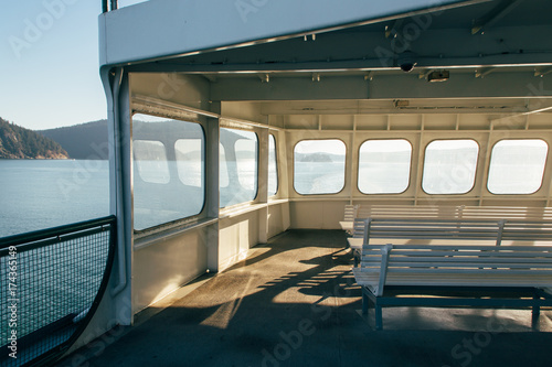 Windows Glowing With Sunlight On Upper Deck of Passenger Ferry Boat