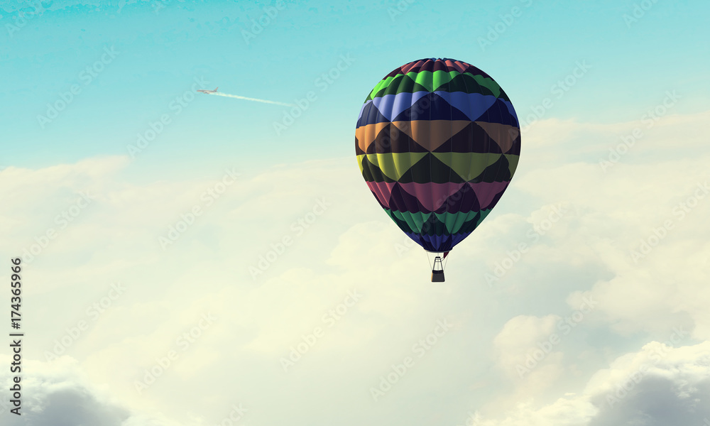 Fototapeta premium Aerostat floating in day sky. Mixed media