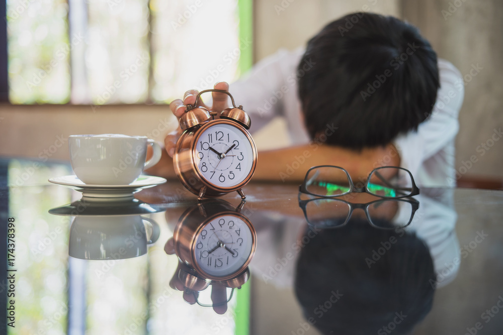 Naklejka premium Tired man sleeping at office having too much work