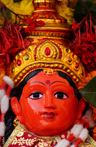 Fototapeta Naklejka Na Ścianę i Meble -  Hindu Goddess asta lakshmi idol on Flower arrangement called Bathukamma during Dussera celebrations