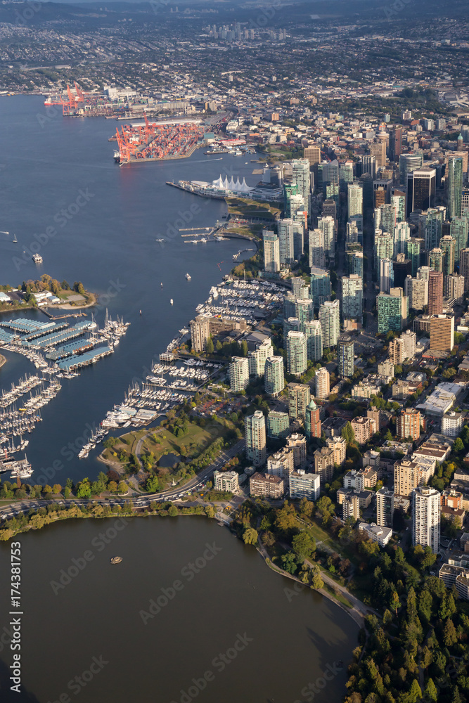 Downtown Vancouver City , Stanley Park and Coal Harbour viewed from an aerial perspective. Picture taken in British Columbia, Canada, during a sunny day.