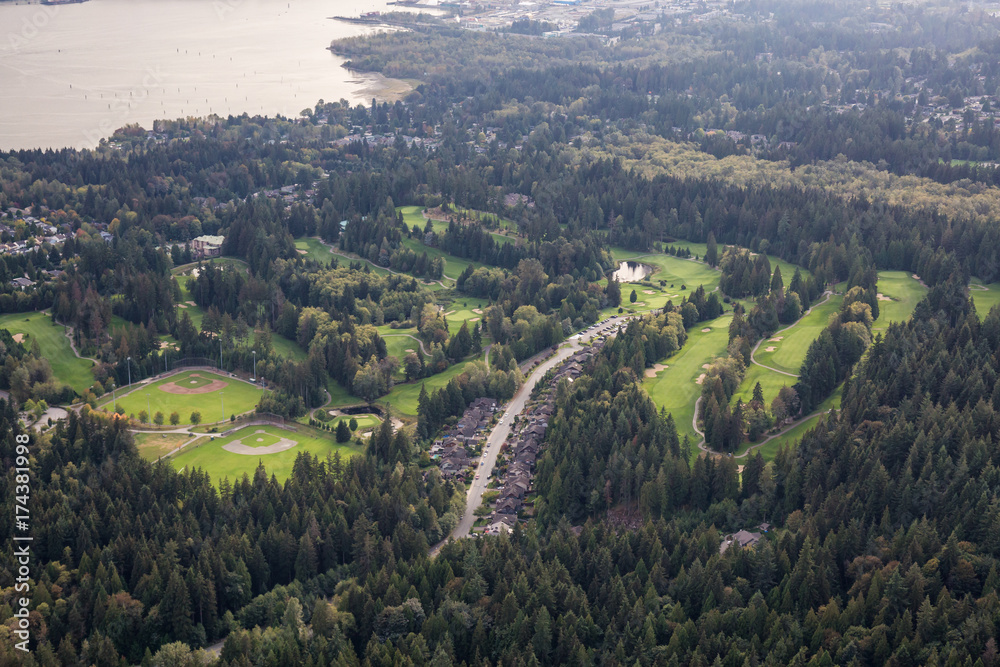 Aerial view on the Golf Course, Baseball Field and residential homes in North Vancouver, British Columbia, Canada.