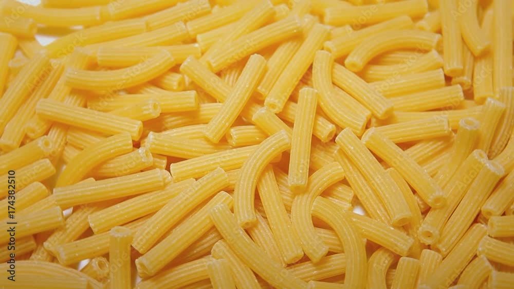 Rotating pasta (small size, ruled shape). Close-up above shot.
Rotating pasta (small size, ruled shape). Close-up above shot.