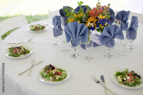 Wildflower Wedding Centerpieces with Black Eyed Susans  Snapdragons  and Delphinium on a Reception Table with White Tablecloth