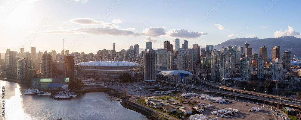 Fototapeta premium Aerial Panoramic View of Vancouver Downtown City Skyline around False Creek during a bright sunset.