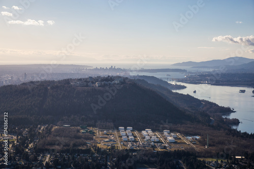 Aerial view of Burnaby Moutain, SFU, and Vancouver Downtown in the background.
