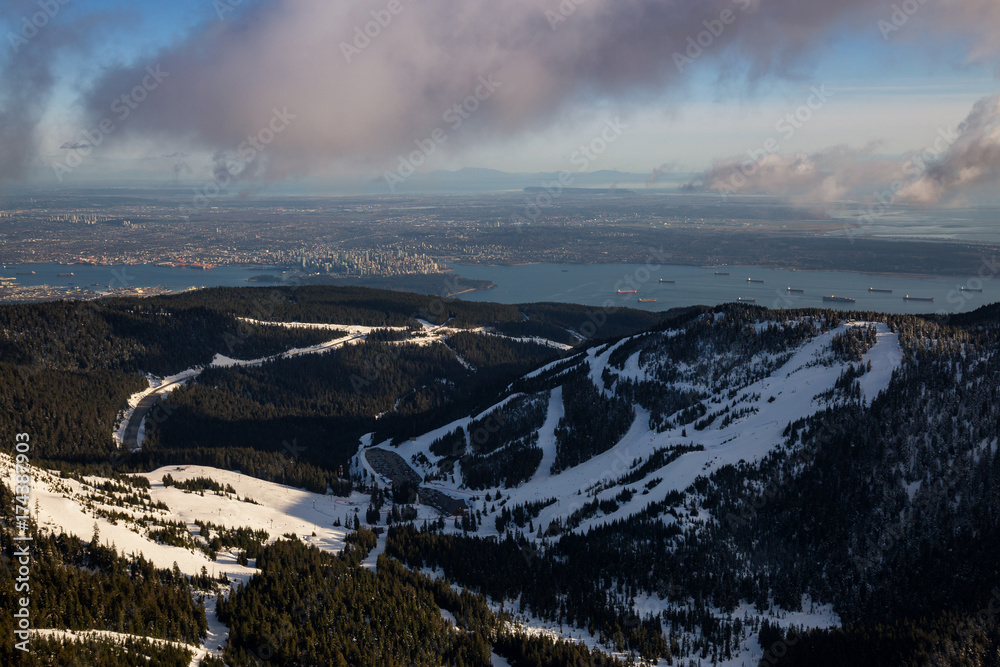 Fototapeta premium Cypress Mountain from an aerial perspective with Vancouver City, BC, Canada, in the background.