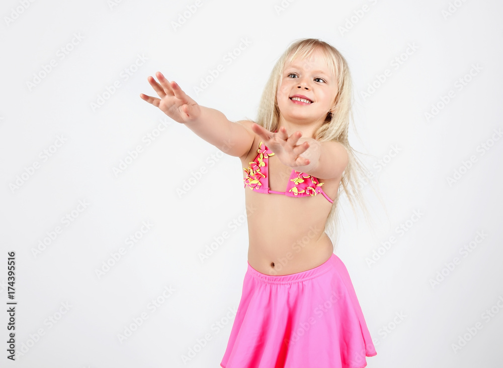 Beautiful teen girl dancing dressed in swimsuit, on white background Beautiful teen girl dancing dressed in swimsuit, on white background