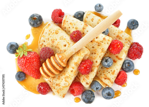 French crepes with berries and honey