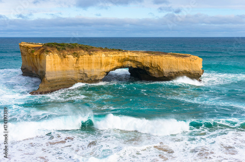 Rock with arch in the ocean