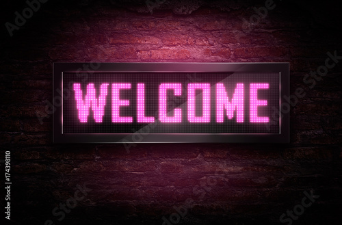 Canvas Print Welcome Led signage on brick wall