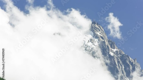 Timelapse: Clouds rushing by the Aguille di Midi observation deck next to Mont Blanc. Chamonix in the Alps along the Tour du Mont Blanc.