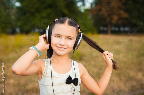 pretty girl with long hair listening song