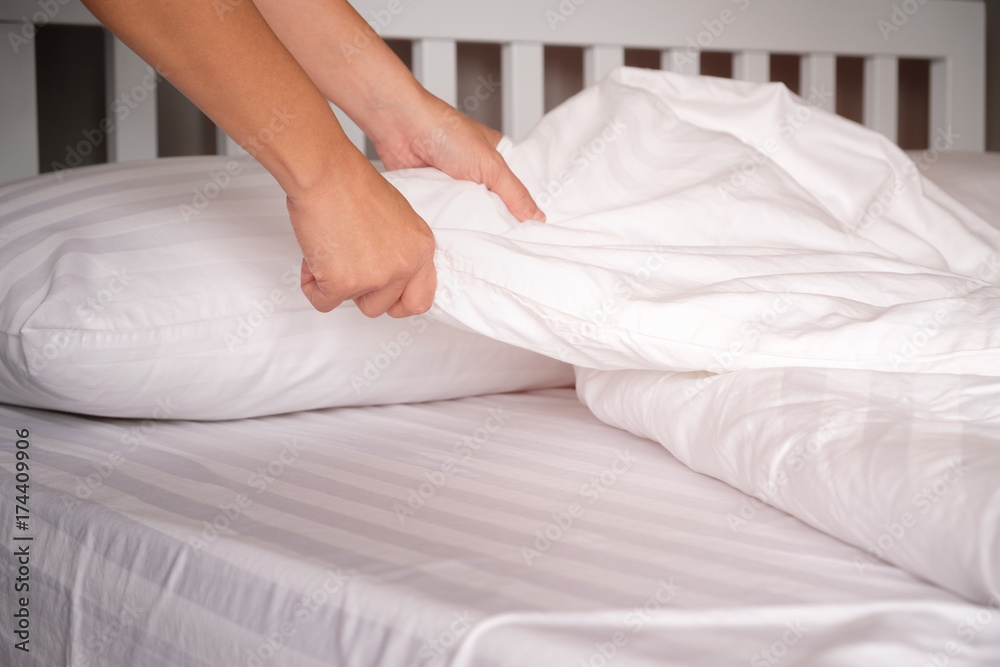 The hands of housewives who are changing sheets in hotels. The hands of housewives who are changing sheets in hotels.