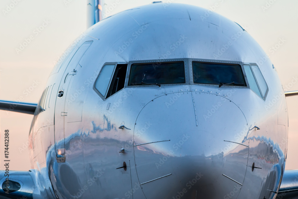 Obraz premium Close-up front of the fuselage of the passenger airplane