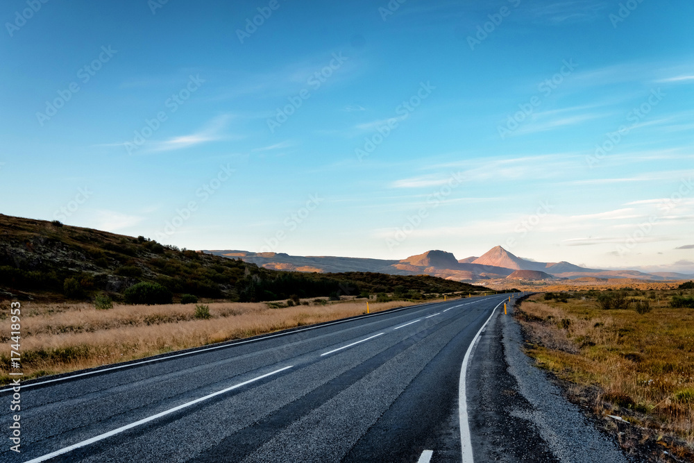 Scenic view of remote road on Iceland surrounded by dramatic landscape. Scenic view of remote road on Iceland surrounded by dramatic landscape.