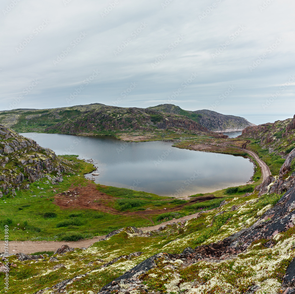 Lake with clean, fresh water on the shore of the Barents sea. Kola Peninsula , Russia.