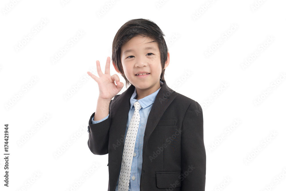 child in business suit showing ok sign child in business suit showing ok sign