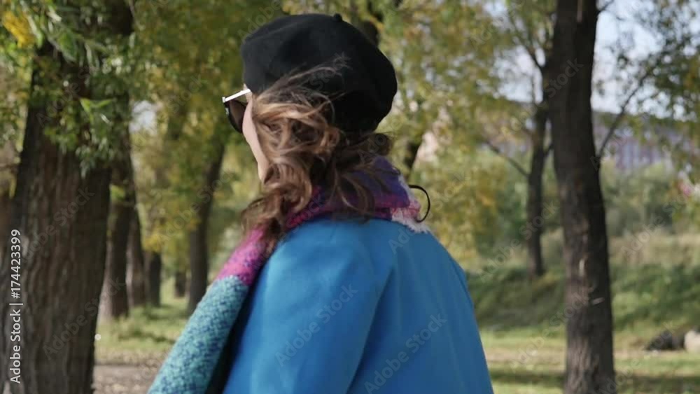 Beautiful girl walking through the autumn forest Beautiful girl walking through the autumn forest