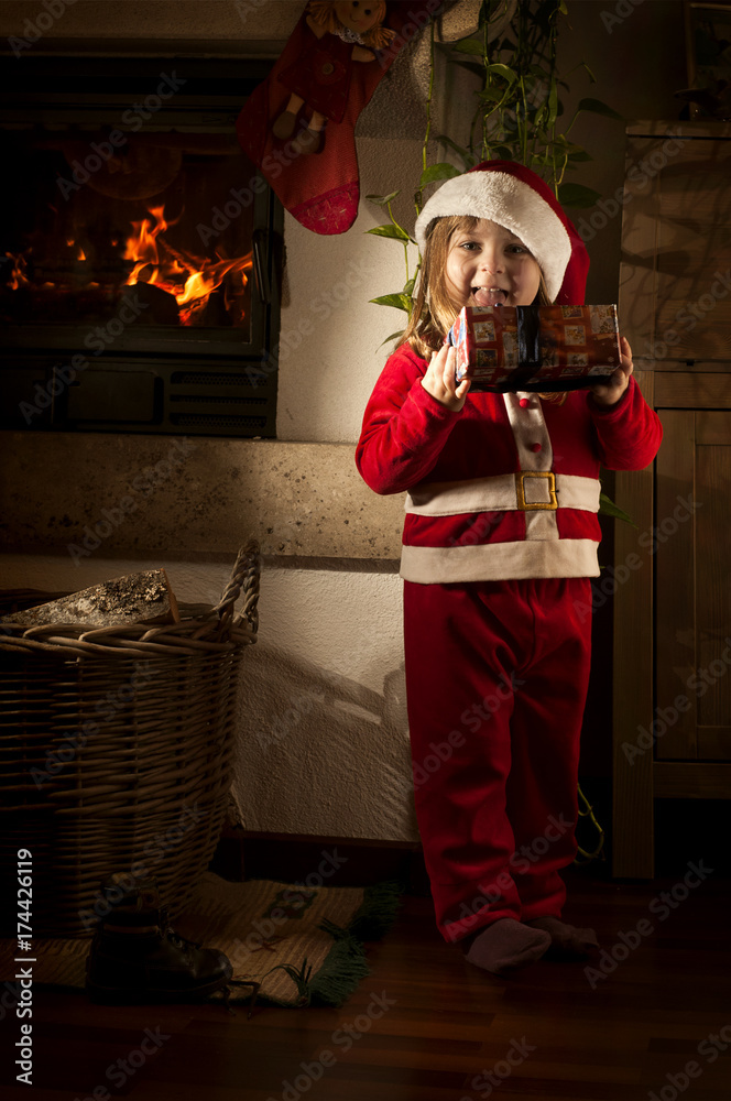 Little caucasian girl disguised as Santa Claus