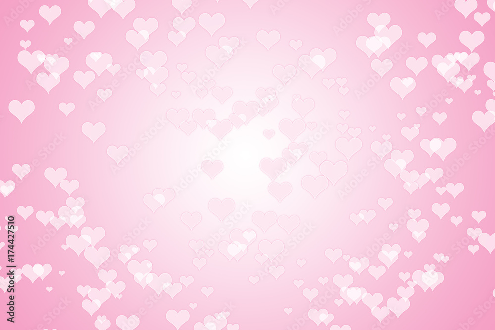 A pink hearts background in a bokeh style effect for Valentine's Day. Bokeh background image of white heart on pink.