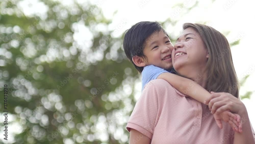 Asian child on a piggy back ride with her mother,slow motion3 Asian child on a piggy back ride with her mother,slow motion3