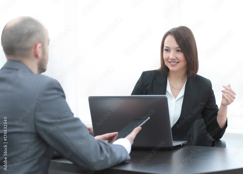 Business people working together at the desk in the office Business people working together at the desk in the office