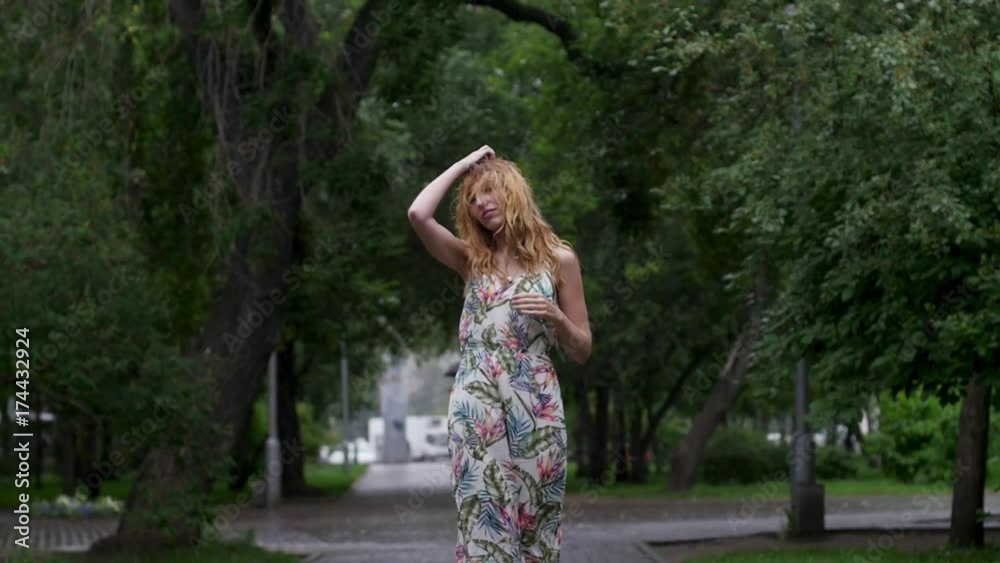 portrait of young beautiful woman in rain. slow motion portrait of young beautiful woman in rain. slow motion