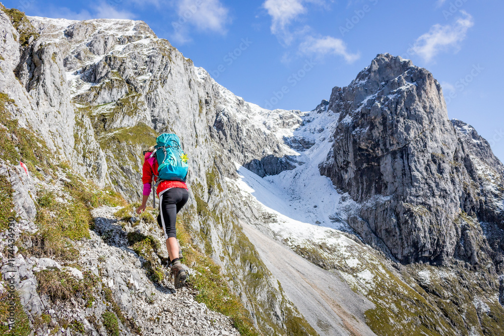 Female hiker on a snowcapped mountains