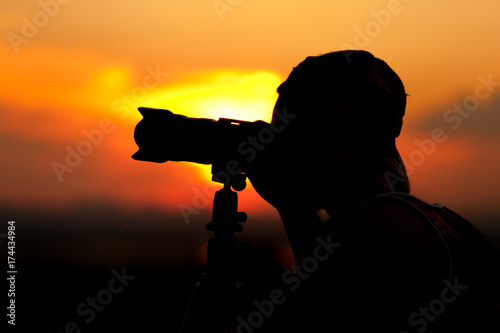 Silhouette of male photographer taking pictures