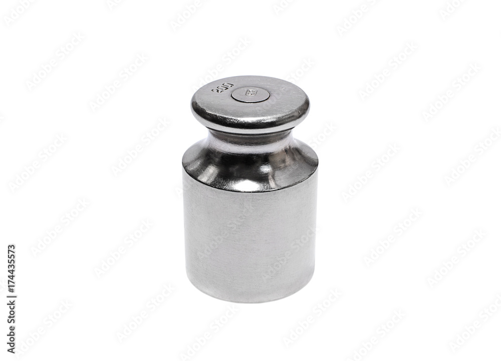Metal weight for scales on white background closeup Metal weight for scales on white background closeup