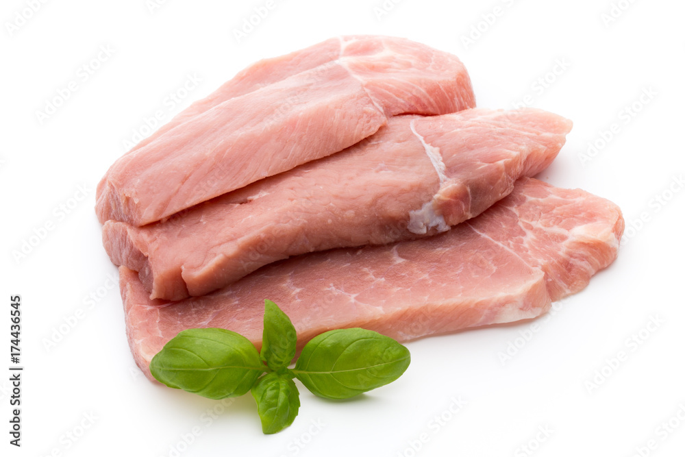 Fresh pork fillet with basil on a white background. Fresh pork fillet with basil on a white background.