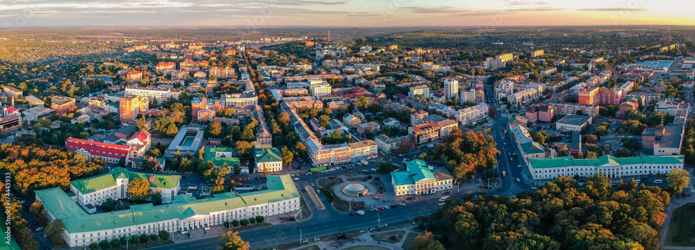 Aerial panoramic view on central park in Poltava city, Ukraine. Sunset, low light image.