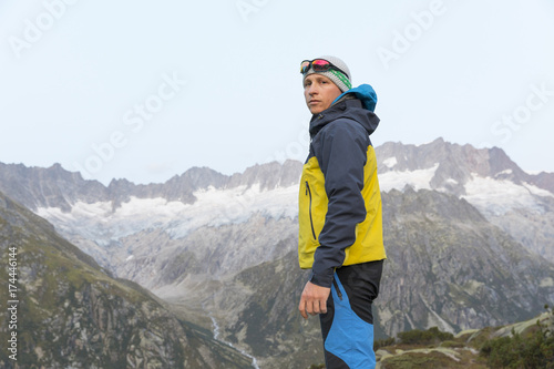 Hiker looks at the camera with a serious facial expression