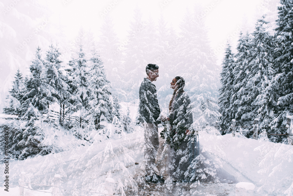 Young pretty pair of lovers. Winter. Date. A pair of lovers on a date in the mountains.