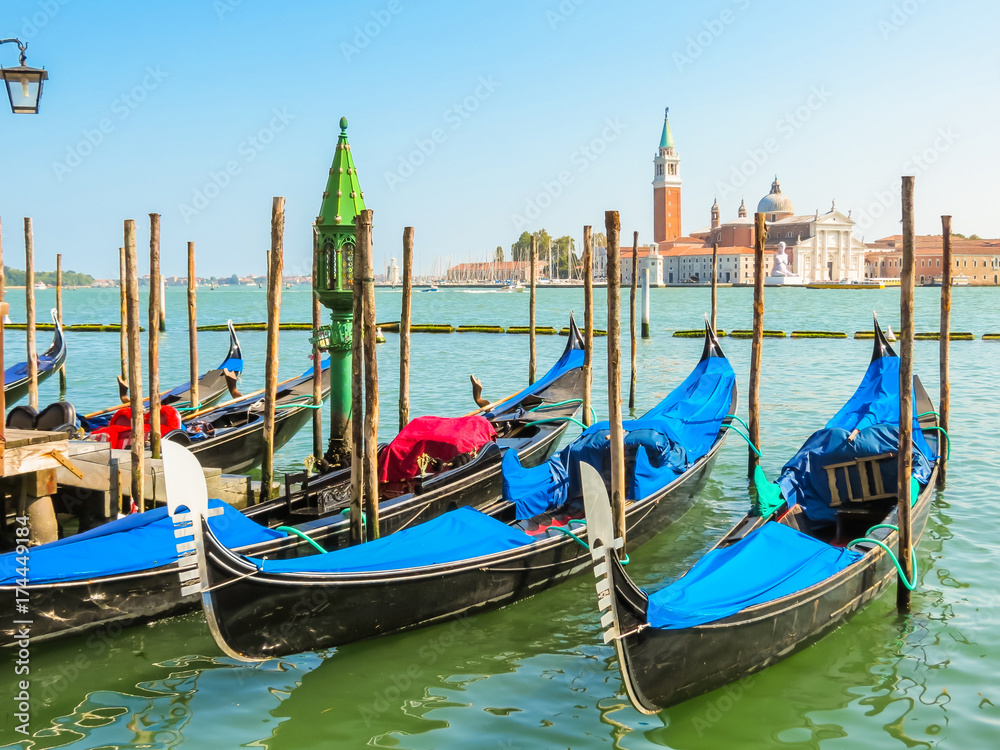 Gondolas moored in the Venetian lagoon