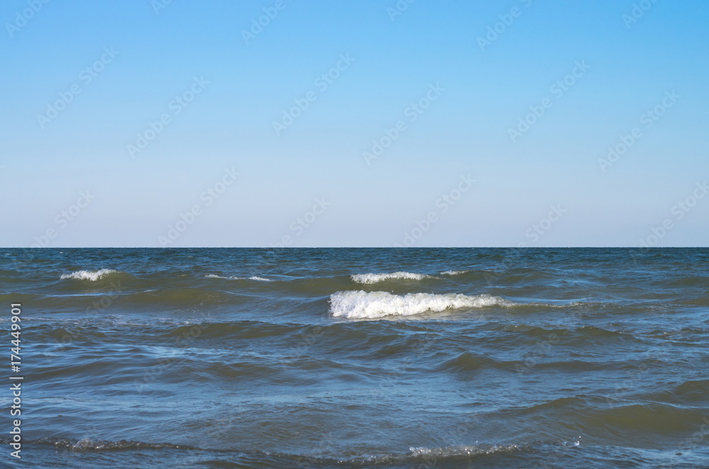 sea wave with white spray, horizon. Blue sky. Azov. Ukraine.