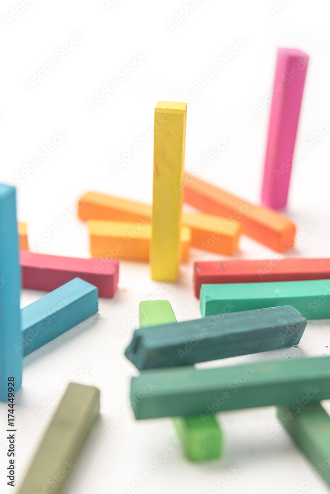 Cropped of group colored pastel chalks in a chaotic manner Cropped of group colored pastel chalks in a chaotic manner