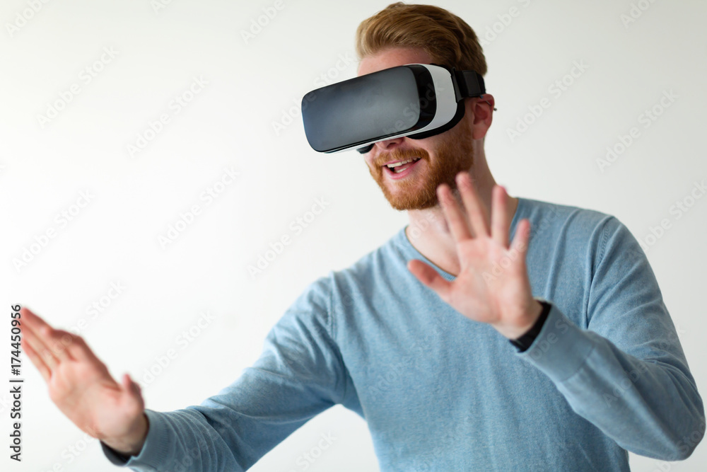 Man wearing virtual reality headset at home Man wearing virtual reality headset at home