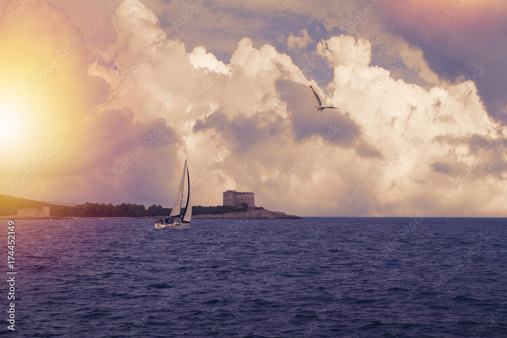 Photo of a beautiful scenic sea and sky landscape. Yacht in sea. Lightly toned