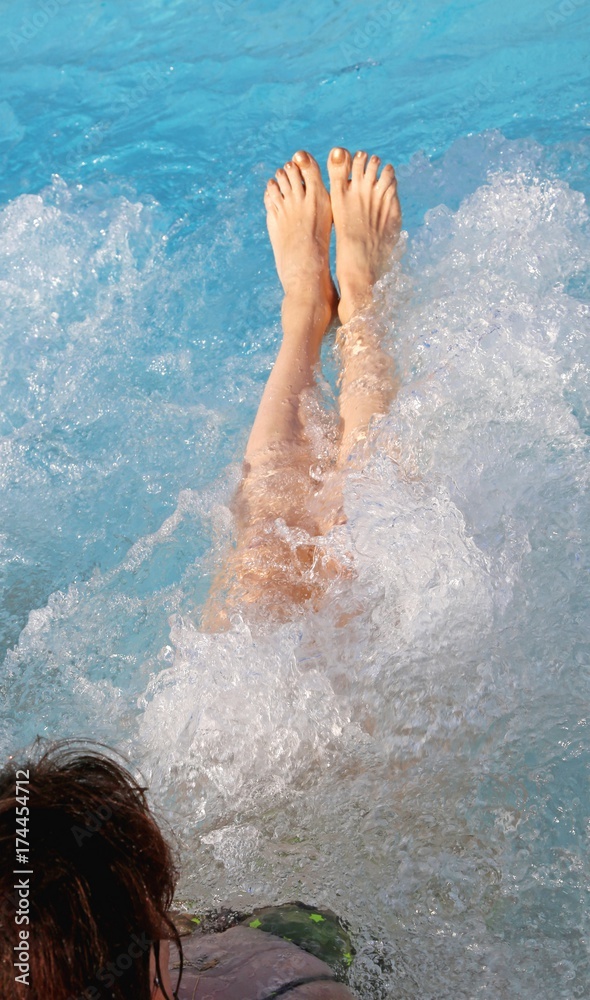 bare feet of the girl during hydro massage therapy bare feet of the girl during hydro massage therapy