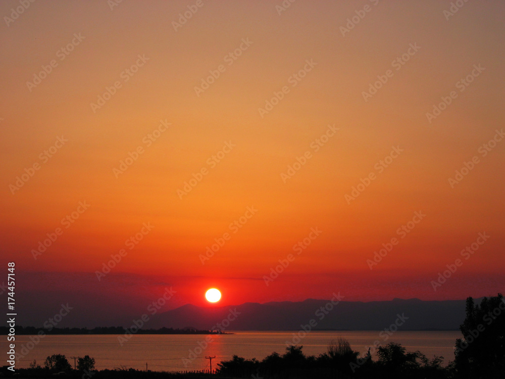 Amazing Sunset Sunrise With Sun Over Sea