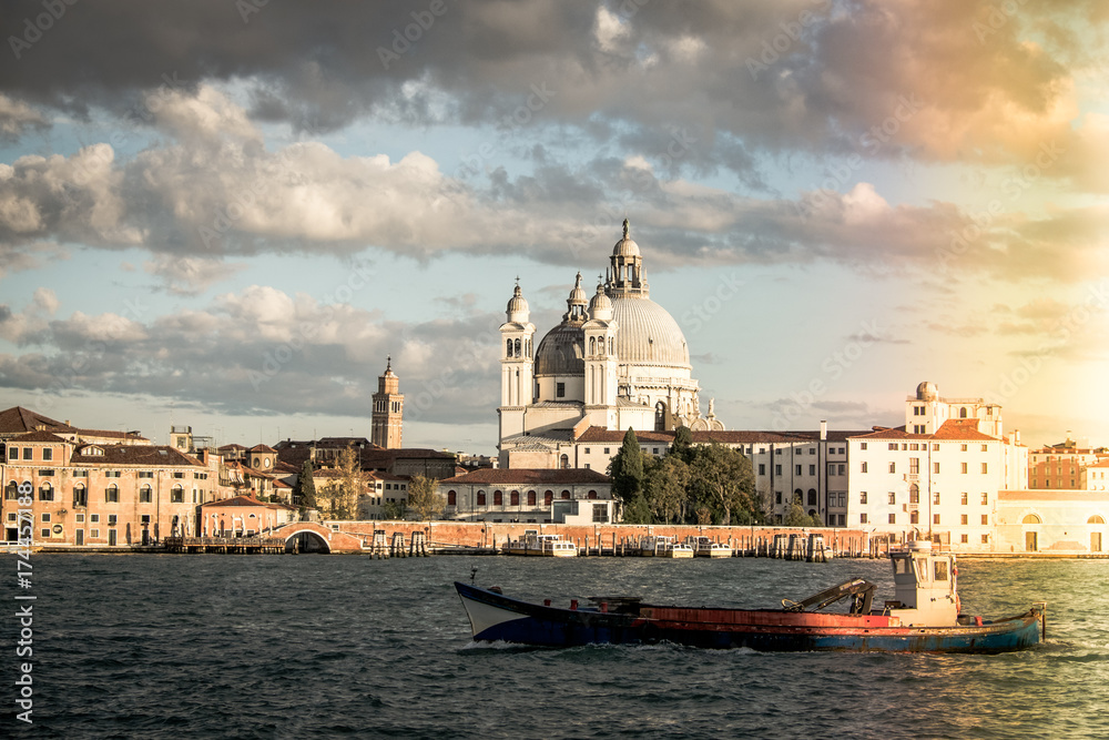 Basilica di Santa Maria della Salute, Background Venice in Italy with boats and church Salute, Venetian lagoon with Basilica di Santa Maria della Salute, Symbol of Venice vintage
