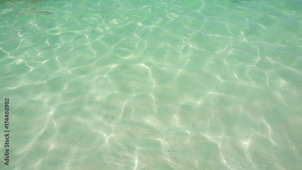 sand and waves splashing the beach,crystal clear water. sand and waves splashing the beach,crystal clear water.