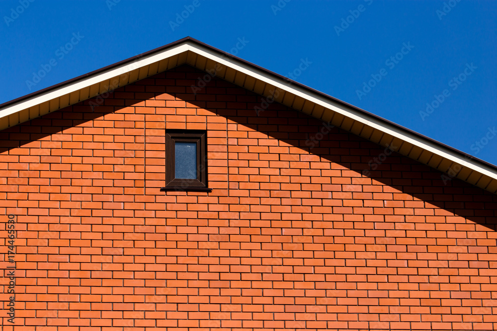 roof with a window in a brick house roof with a window in a brick house